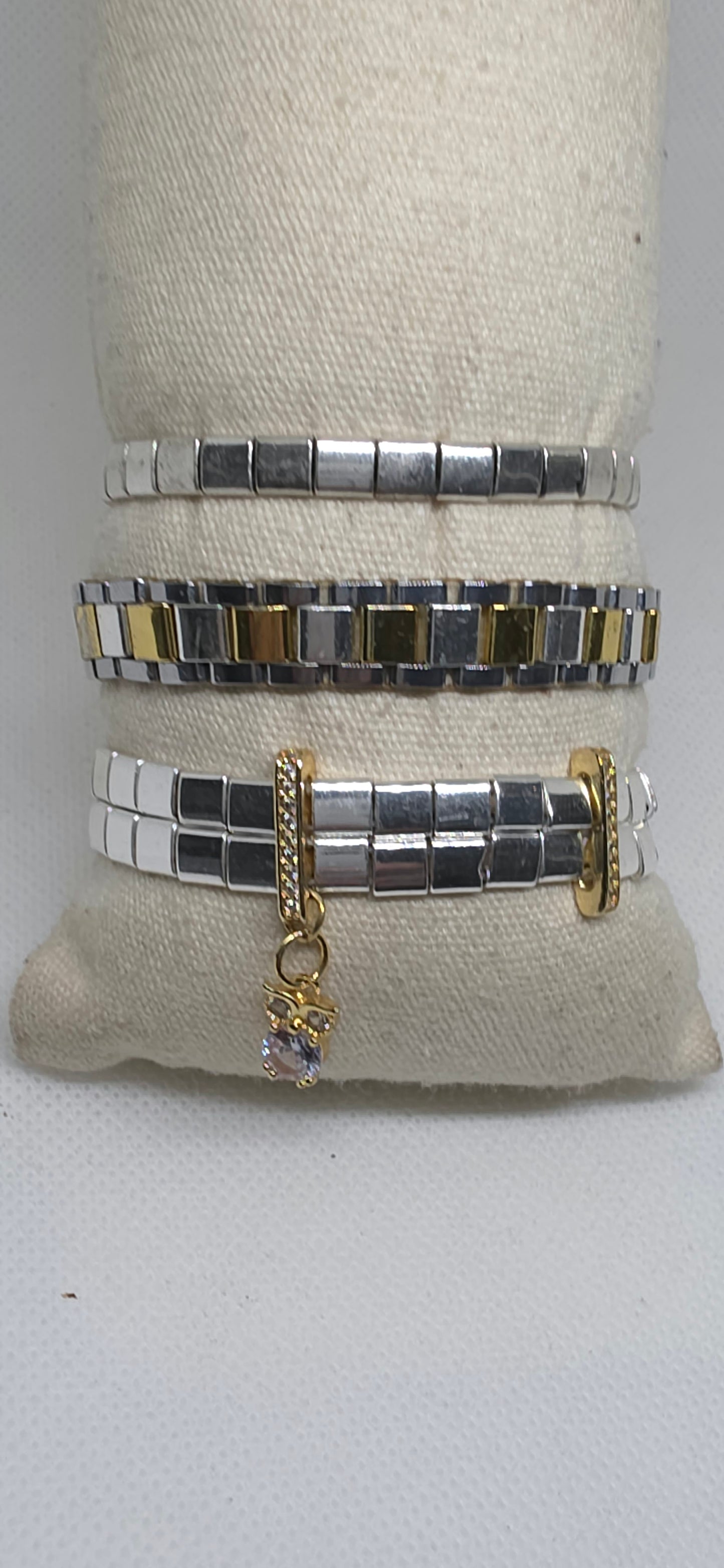 Elegant silver hematite bracelet stack with cubic zirconia charm from the Metal Motion Collection.