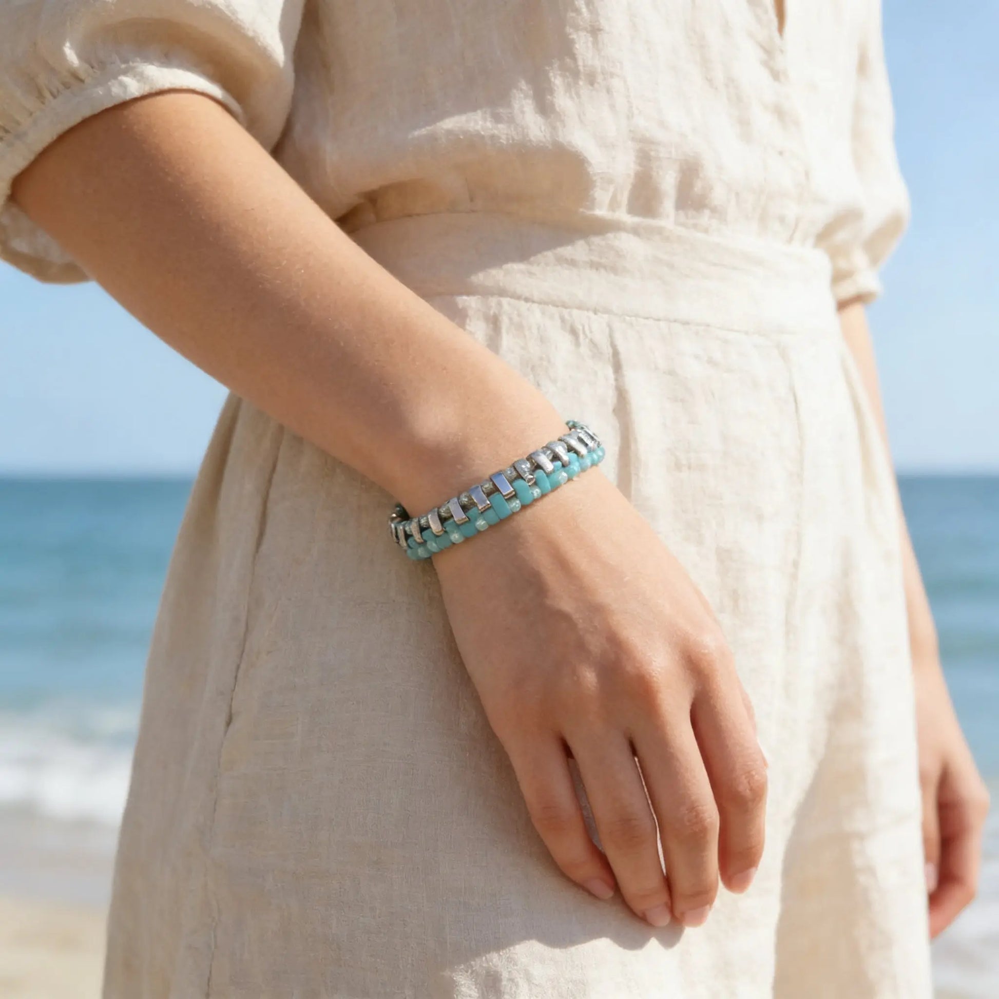 Gem N Glow by Natali Laguna Glow bracelet featuring shimmering beads and a stylish design on a delicate silver chain.