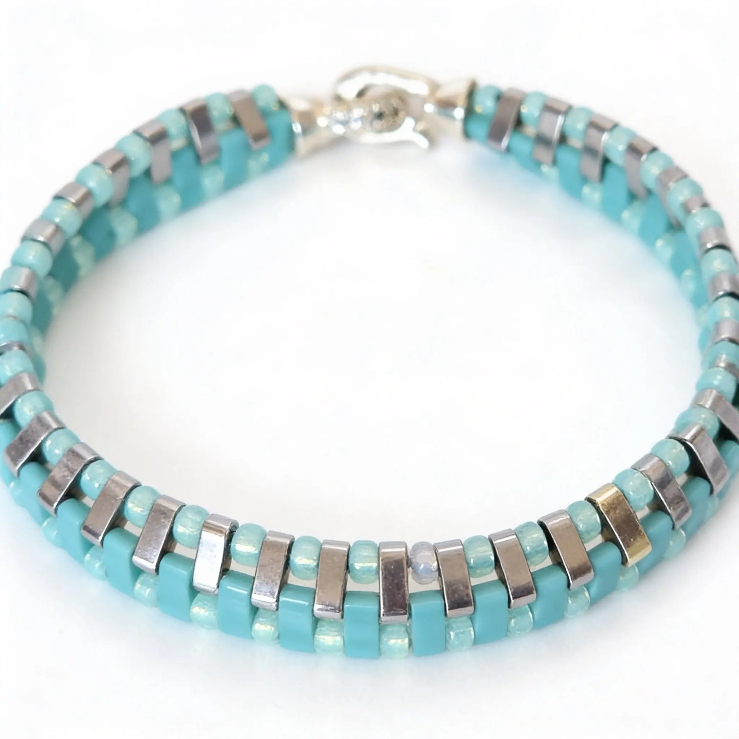 Gem N Glow by Natali Laguna Glow bracelet featuring shimmering beads and adjustable cord on a neutral background.