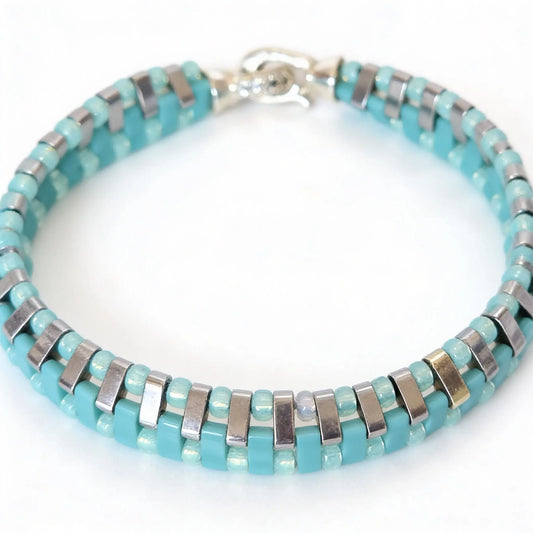 Gem N Glow by Natali Laguna Glow bracelet featuring shimmering beads and adjustable cord on a neutral background.
