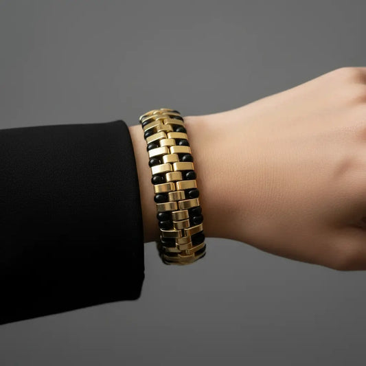Handmade black and gold Miyuki Tila bead bracelet from the Noir Structure Collection